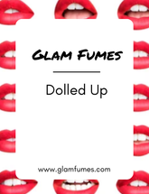 Product image featuring multiple lips with the product name 'Glam Fumes - Dolled Up' perfume and body oil displayed across the center.